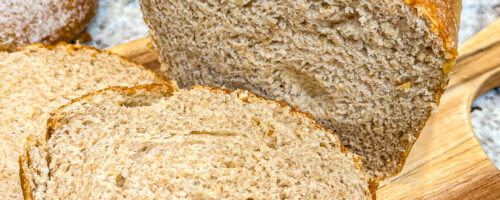 Old Fashioned Sourdough Sandwich Bread sliced on cutting board