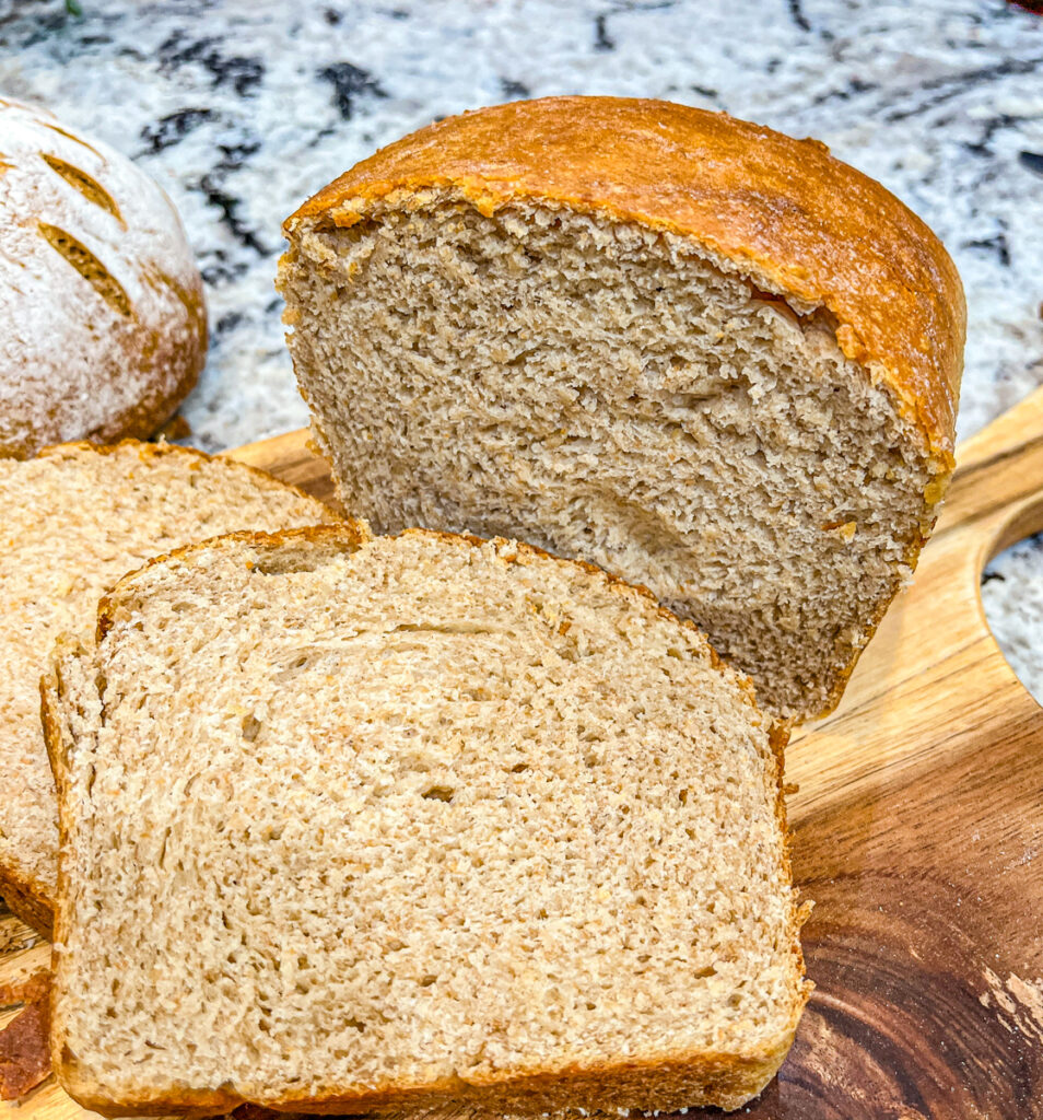 Old Fashioned Sourdough Sandwich Bread sliced on cutting board