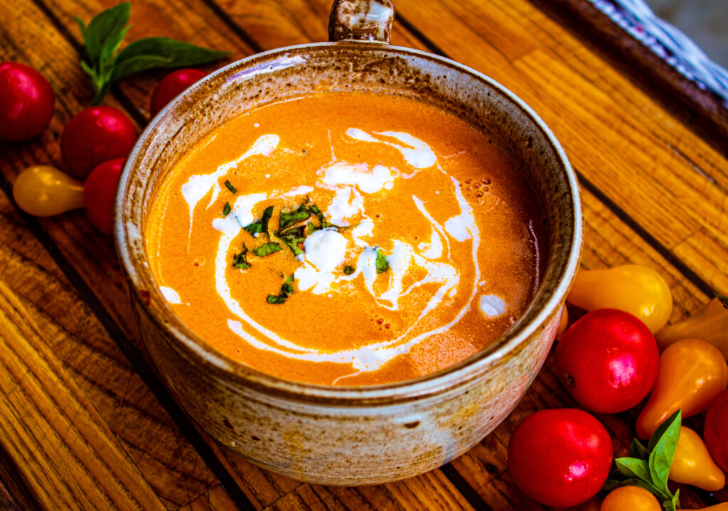 This tomato soup is just the best. Add a grilled cheese sandwich and you have one of my very favorite meals of all time. It is simple, flavorful, rich and actually very hearty and filling. I like to make this soup with fresh tomatoes  and fresh basil when they are abundant in the fall. You can use canned tomatoes and dried basil too. Either way, you are guaranteed to love this Creamy Tomato Soup 