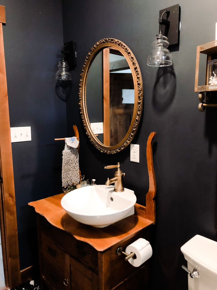 Does a sexy dark wall color in a SMALL bathroom scare you? Don't let it. Dark walls - even black can be done. The resulting space is moody, intimate cozy and Timeless. Let share with you how you too can create this look. 