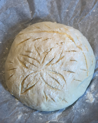 5 ingredient French bread dough scored, risen and ready to bake