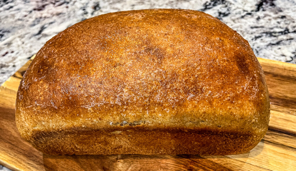 Old Fashioned Sourdough Sandwich Loaf Baked on cutting board