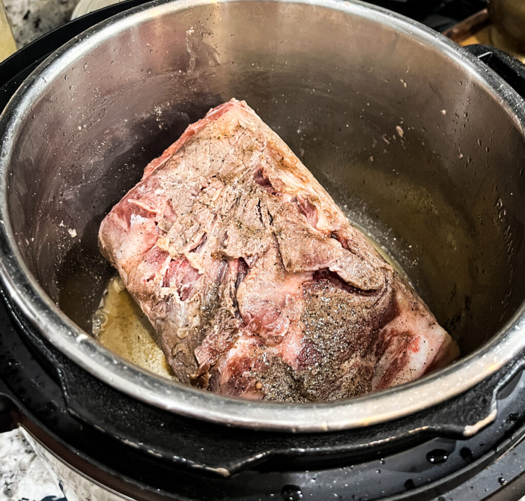 Instant pot pork carnitas flipped to sear