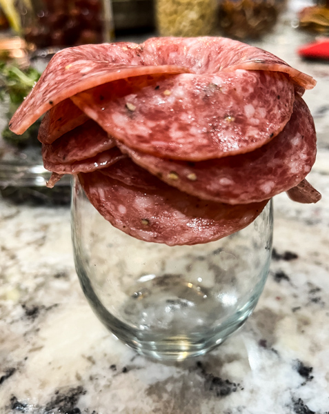 Salami rose on wine glass for charcuterie board
