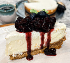 Homemade rich and creamy cheesecake with blueberry topping